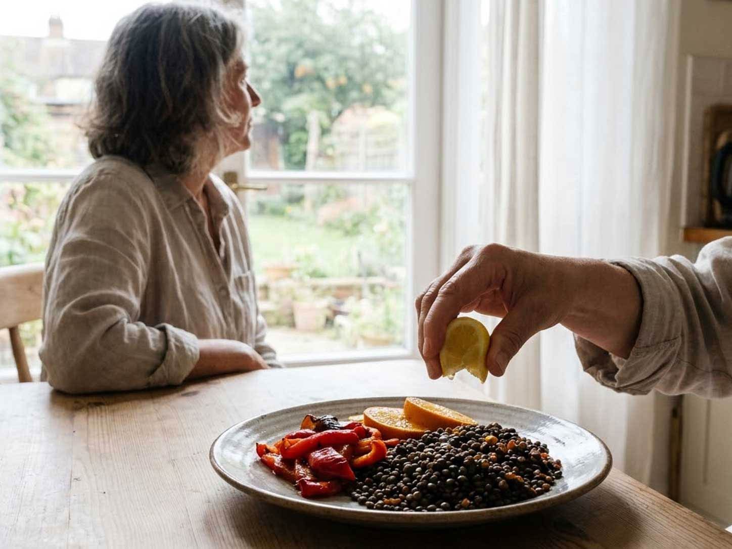 Lentils served beside bell peppers and citrus